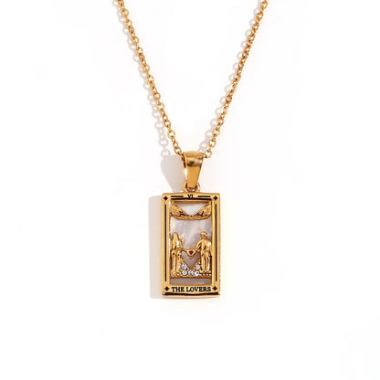 Gold pendant necklace with 'The Lovers' tarot card design on a white background