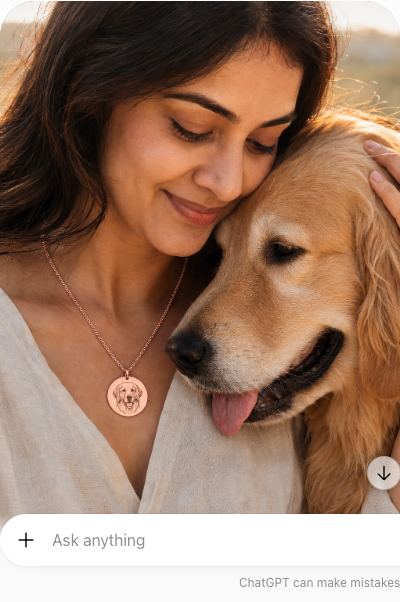 Woman wearing the rose gold Inner Ziva Pet Portrait Disc at her neckline, embracing her dog