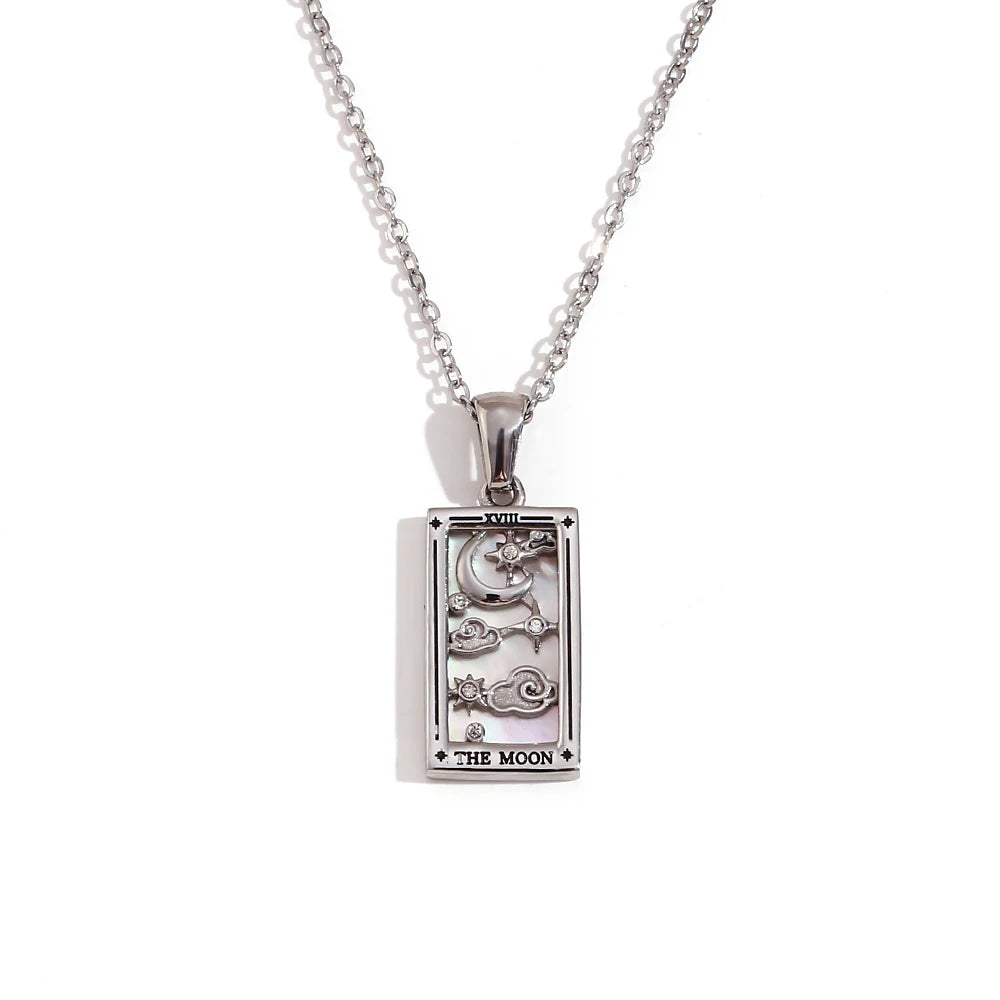 Silver pendant with 'The Moon' tarot card design on a white background