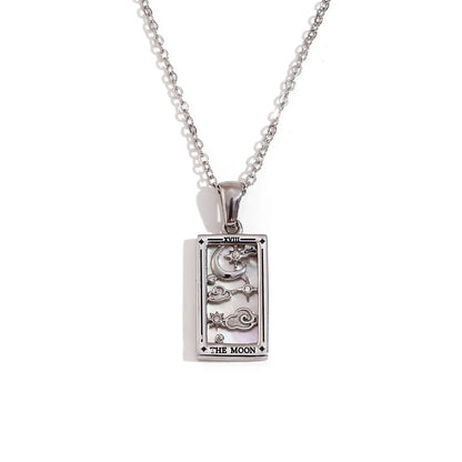 Silver pendant with 'The Moon' tarot card design on a white background