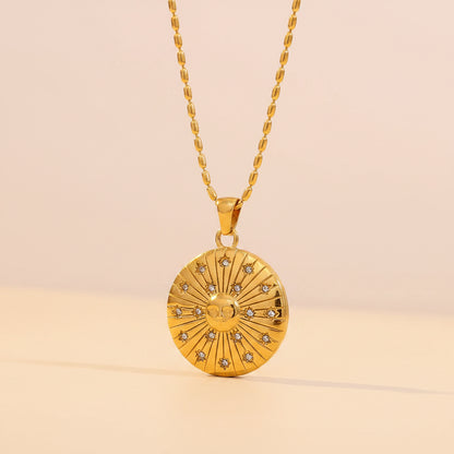 Gold necklace with a circular pendant on a beige background