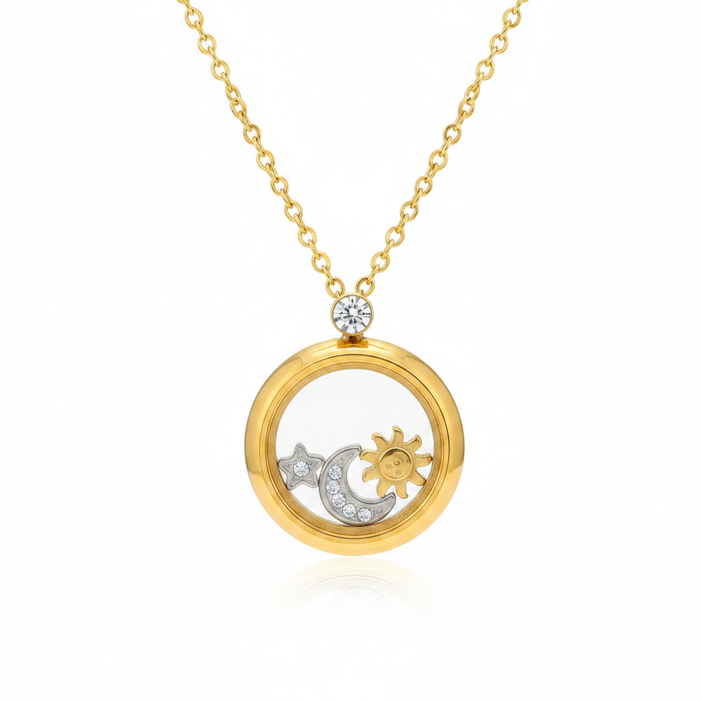 A gold pendant necklace displayed on a cream jewelry stand, featuring a circular open locket with a gold sun and moon design and a small clear crystal at the top. Text on the left highlights 18k gold and treatment features like water washing and electrolytic oil removal.