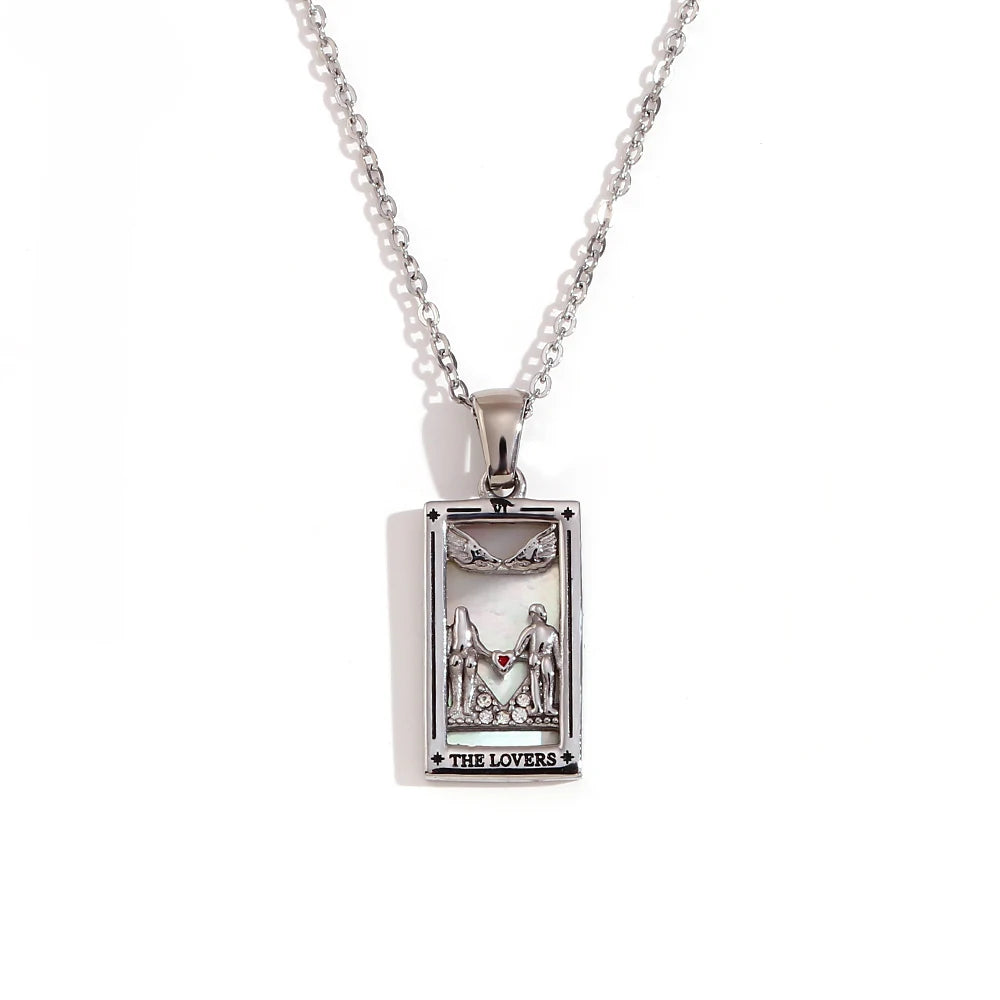 Silver pendant with 'The Lovers' design on a white background