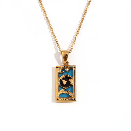 Gold-tone necklace with a rectangular pendant featuring a turquoise blue background, a gold globe design, and the words 'THE WORLD' at the bottom, shown on a white background.