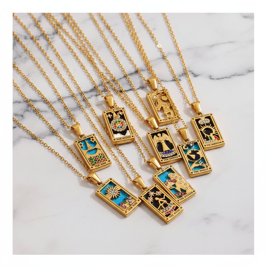 Gold necklaces with various pendants on a shell background